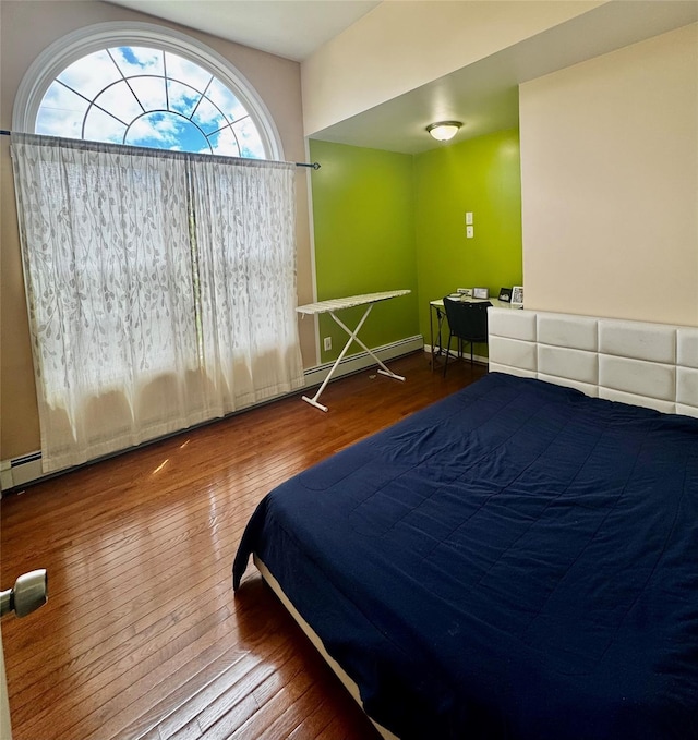 146 Grand Blvd, Brentwood, NY 11717 - bedroom with hardwood / wood-style floors and baseboard heating