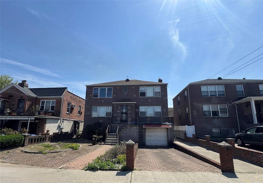 1208 Astor Ave, Bronx, NY 10469 - multi unit property with a garage and decorative driveway