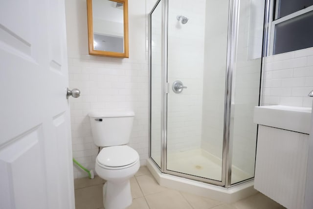 140-37 Cherry Unit 5C, Flushing, NY 11355 - full bathroom with tile walls, a stall shower, tile patterned floors, and toilet