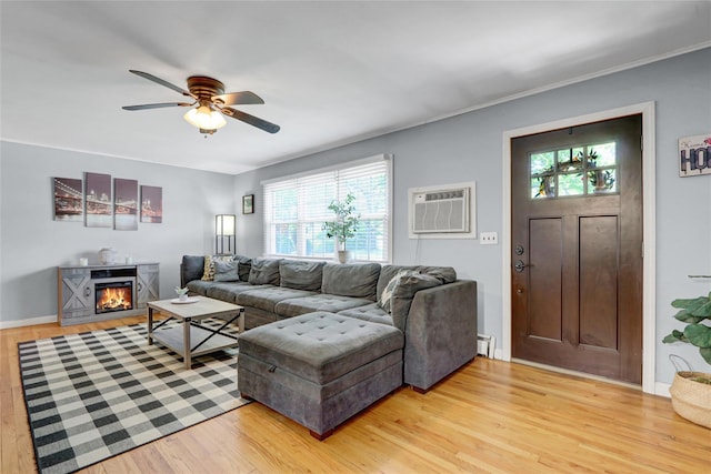 77 N Prospect Ave, Patchogue, NY 11772 - living area featuring an AC wall unit, light wood-type flooring, and plenty of natural light