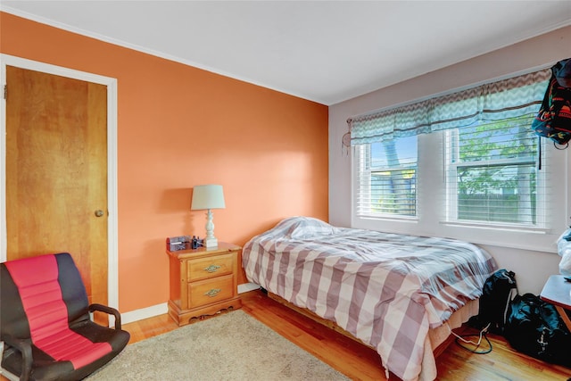 77 N Prospect Ave, Patchogue, NY 11772 - bedroom featuring wood finished floors and crown molding