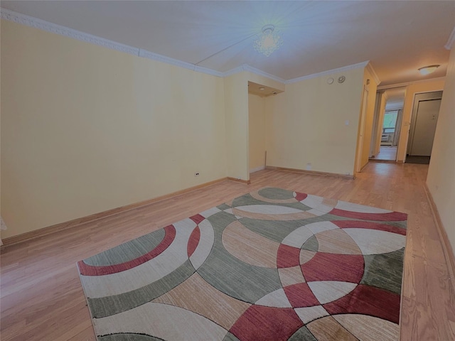 61-15 97th St Unit Ll, Rego Park, NY 11374 - unfurnished room featuring light wood-style floors, crown molding, and baseboards
