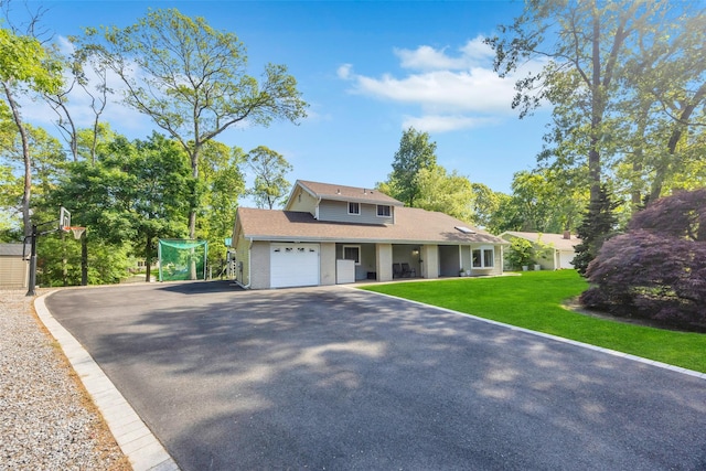 5 Firwood Dr, Farmingville, NY 11738 - view of front facade featuring an attached garage, asphalt driveway, and a front lawn