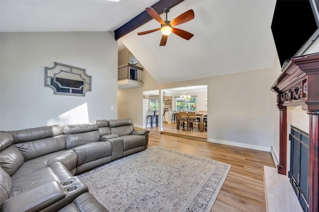 5 Firwood Dr, Farmingville, NY 11738 - living area featuring ceiling fan, a chandelier, light wood-style flooring, beam ceiling, and a fireplace