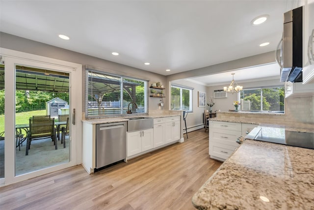 5 Firwood Dr, Farmingville, NY 11738 - kitchen featuring appliances with stainless steel finishes, a sink, a chandelier, a baseboard radiator, and white cabinets