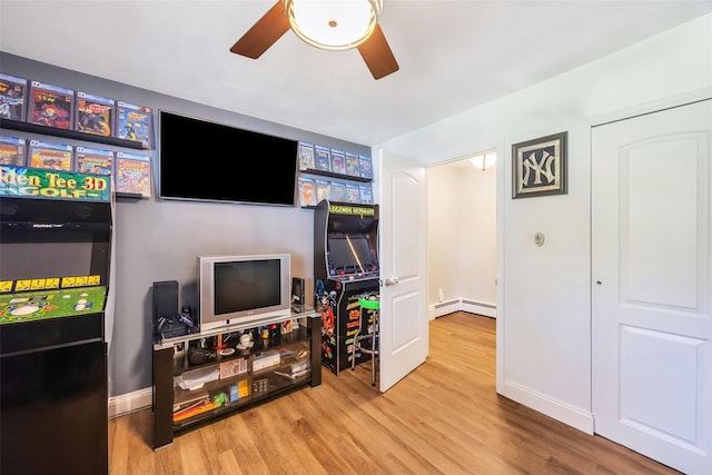 5 Firwood Dr, Farmingville, NY 11738 - recreation room with a ceiling fan, wood finished floors, baseboards, and baseboard heating