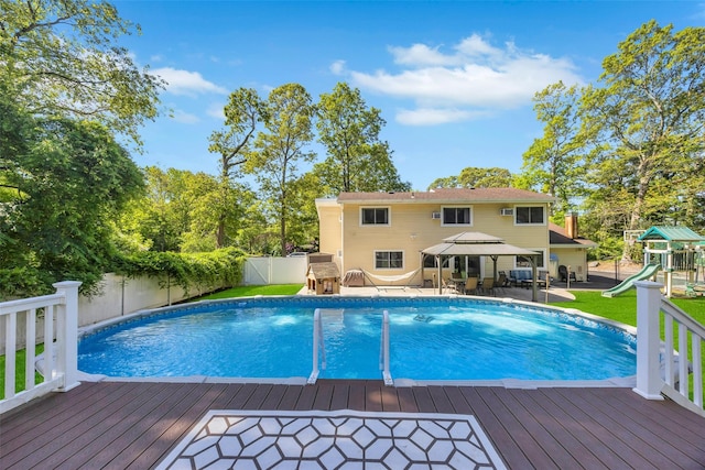 5 Firwood Dr, Farmingville, NY 11738 - view of swimming pool featuring a deck, a playground, a gazebo, a patio, and outdoor dining space