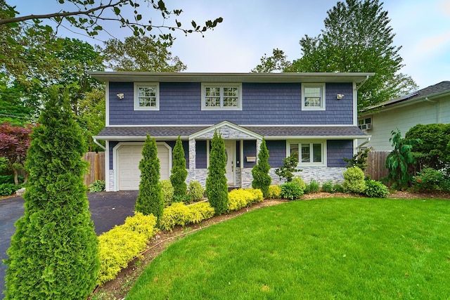 2 Hawthorne St, Farmingdale, NY 11735 - view of front of house featuring stone siding, asphalt driveway, and a garage
