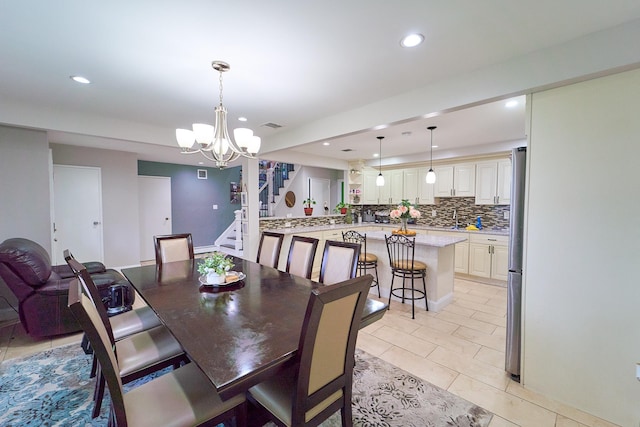 2 Hawthorne St, Farmingdale, NY 11735 - dining area featuring recessed lighting, stairway, a chandelier, and light tile patterned floors