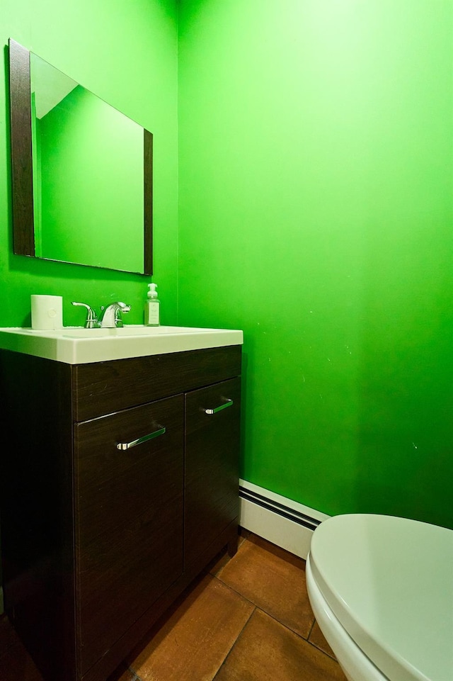 2 Hawthorne St, Farmingdale, NY 11735 - bathroom featuring a baseboard radiator, vanity, and baseboards