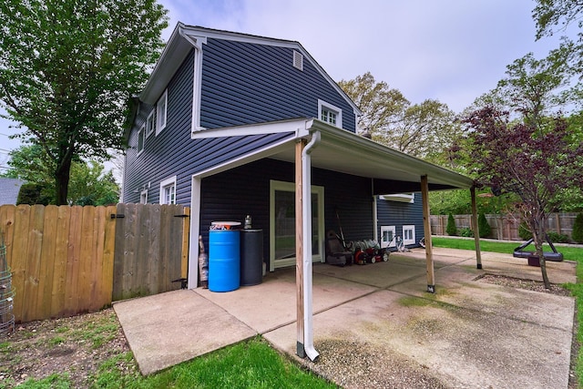 2 Hawthorne St, Farmingdale, NY 11735 - view of side of property featuring a patio area and a fenced backyard