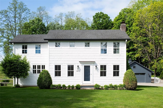 620 Rte 343, Millbrook, NY 12545 - colonial home with a chimney, an outbuilding, a front lawn, and a shingled roof