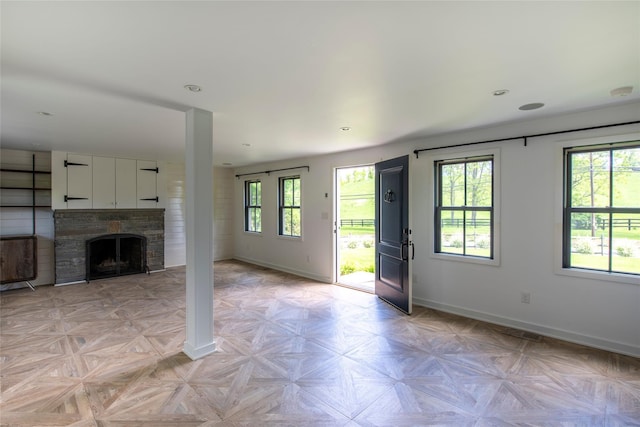 620 Rte 343, Millbrook, NY 12545 - unfurnished living room with baseboards, a fireplace, and recessed lighting