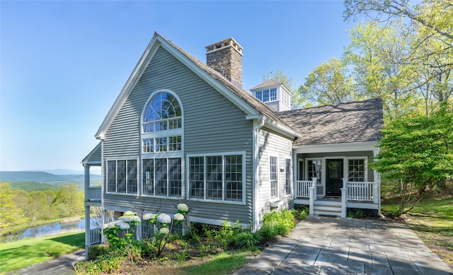 139 Charlie Hill Rd, Millerton, NY 12546 - view of front of house with a water view and a chimney