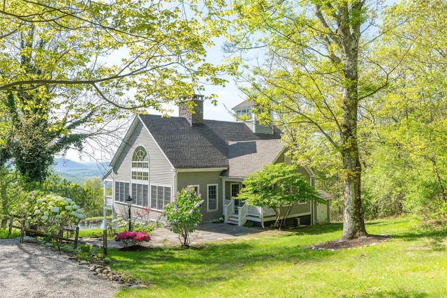 139 Charlie Hill Rd, Millerton, NY 12546 - view of front facade featuring a shingled roof, a wooden deck, a front lawn, a chimney, and a patio