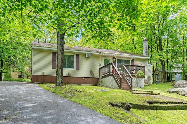 397 Mine Rd, Monroe, NY 10950 - view of front facade featuring a wooden deck, stairway, a front lawn, and a chimney