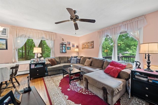 397 Mine Rd, Monroe, NY 10950 - living room featuring plenty of natural light, hardwood / wood-style floors, a ceiling fan, and baseboard heating