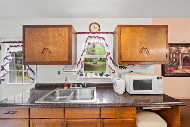 397 Mine Rd, Monroe, NY 10950 - kitchen featuring white microwave, a sink, plenty of natural light, and brown cabinetry