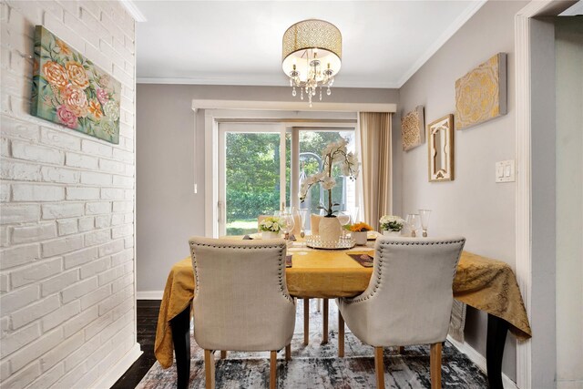 15 W Forest Ave, Freeport, NY 11520 - dining space with a chandelier, dark wood-type flooring, and crown molding
