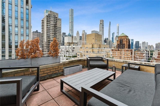205 E 63rd St Phe, Phe New York Manhattan, NY 10065 - view of patio / terrace with a skyline view, a balcony, and outdoor dining area