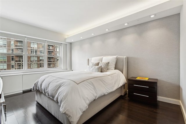 205 E 63rd St Phe, Phe New York Manhattan, NY 10065 - bedroom with dark wood-style flooring, recessed lighting, and baseboards