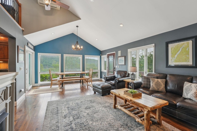 49 Brook Trl, Greenwood Lake, NY 10925 - living area with high vaulted ceiling, wood finished floors, a chandelier, and ceiling fan