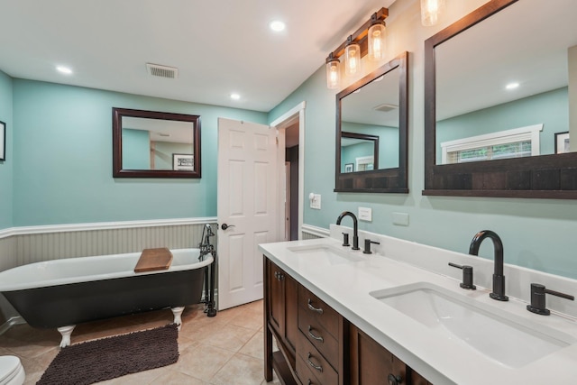 49 Brook Trl, Greenwood Lake, NY 10925 - full bathroom featuring a wainscoted wall, a soaking tub, double vanity, recessed lighting, and tile patterned flooring
