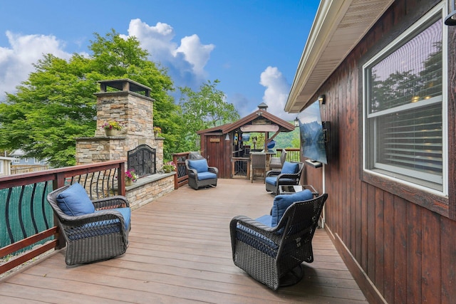 49 Brook Trl, Greenwood Lake, NY 10925 - wooden deck with an outdoor stone fireplace