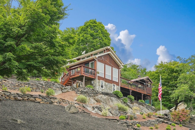 49 Brook Trl, Greenwood Lake, NY 10925 - rear view of house featuring a deck and stone siding