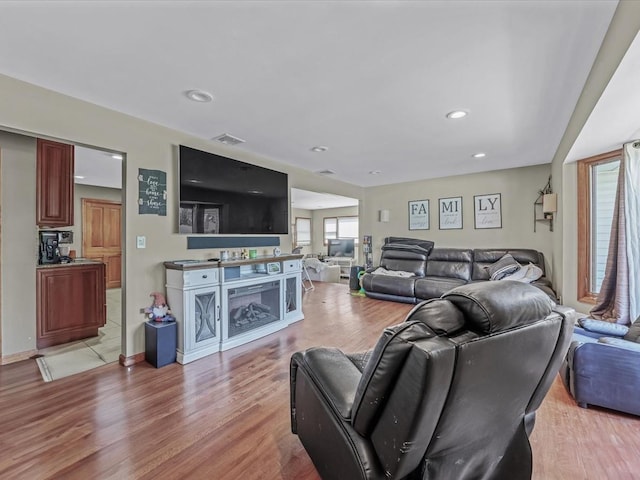 4 Whitebirch Ln, Commack, NY 11725 - living area featuring healthy amount of natural light, light wood-style floors, and recessed lighting