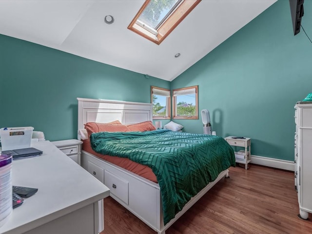4 Whitebirch Ln, Commack, NY 11725 - bedroom featuring a skylight, wood finished floors, baseboards, and high vaulted ceiling