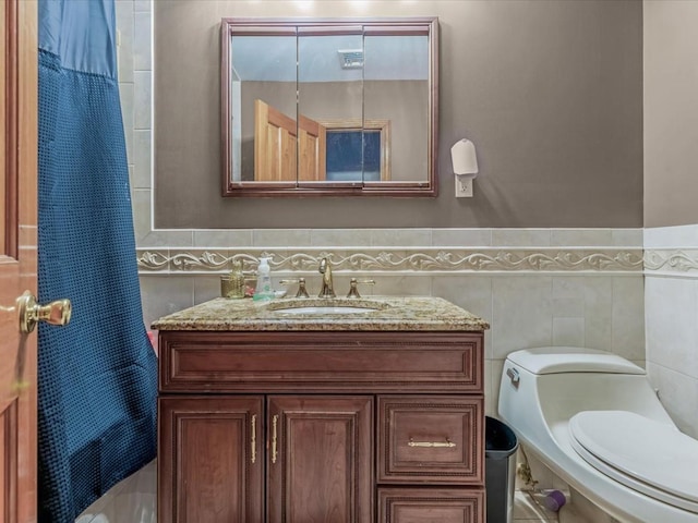 4 Whitebirch Ln, Commack, NY 11725 - bathroom featuring tile walls, toilet, vanity, and wainscoting