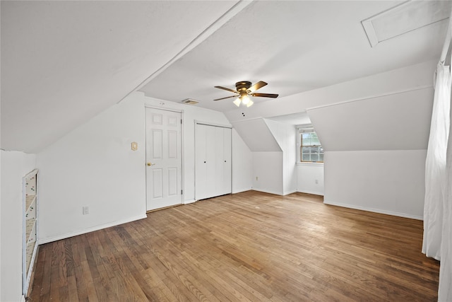 21 Arizona Ave, Syosset, NY 11791 - additional living space featuring a ceiling fan, wood-type flooring, baseboards, and vaulted ceiling