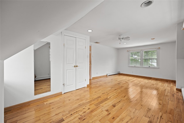 21 Arizona Ave, Syosset, NY 11791 - additional living space with a baseboard radiator, baseboard heating, a ceiling fan, light wood-style floors, and recessed lighting