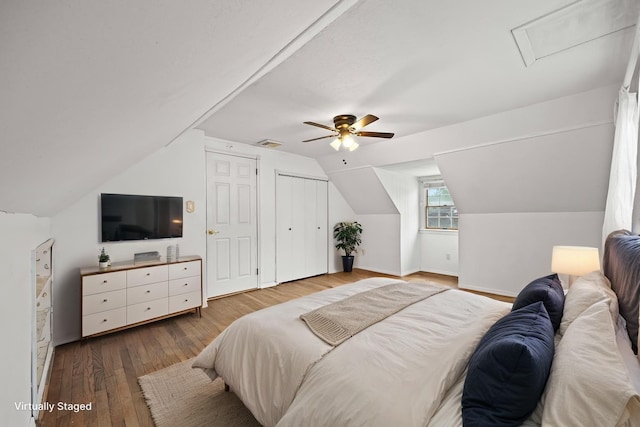 21 Arizona Ave, Syosset, NY 11791 - bedroom with hardwood / wood-style floors, baseboards, ceiling fan, and lofted ceiling
