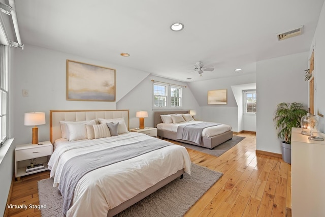 21 Arizona Ave, Syosset, NY 11791 - bedroom with light wood-style floors, vaulted ceiling, ceiling fan, recessed lighting, and baseboards