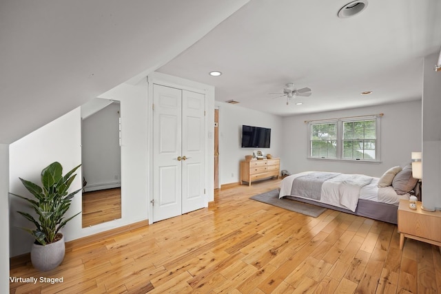 21 Arizona Ave, Syosset, NY 11791 - bedroom with baseboard heating, light wood-type flooring, recessed lighting, and ceiling fan