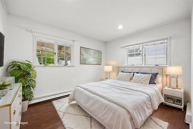 21 Arizona Ave, Syosset, NY 11791 - bedroom with baseboard heating, dark wood-style floors, ornamental molding, and recessed lighting