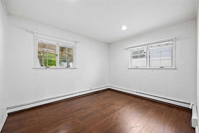 21 Arizona Ave, Syosset, NY 11791 - empty room featuring dark wood-type flooring, ornamental molding, recessed lighting, baseboard heating, and a baseboard heating unit