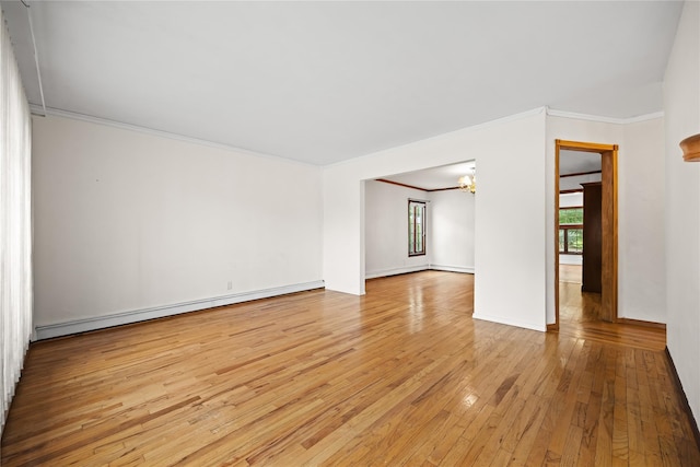 21 Arizona Ave, Syosset, NY 11791 - unfurnished room featuring a baseboard heating unit, light wood-style floors, crown molding, a chandelier, and baseboards