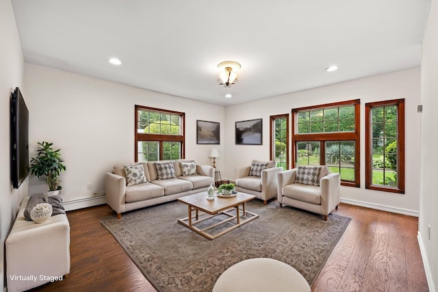 21 Arizona Ave, Syosset, NY 11791 - living area with a baseboard heating unit, healthy amount of natural light, wood finished floors, recessed lighting, and baseboards