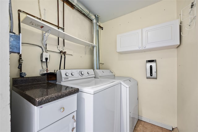 21 Arizona Ave, Syosset, NY 11791 - laundry area featuring cabinet space, washing machine and clothes dryer, baseboards, and light tile patterned floors