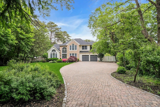 1138 Carlls Straight Path, Dix Hills, NY 11746 - view of front of home with decorative driveway and a garage