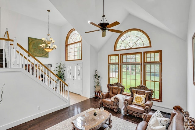 1138 Carlls Straight Path, Dix Hills, NY 11746 - living area with high vaulted ceiling, a chandelier, hardwood / wood-style floors, stairs, and a ceiling fan
