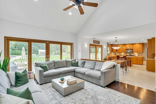 1138 Carlls Straight Path, Dix Hills, NY 11746 - living room with plenty of natural light, high vaulted ceiling, ceiling fan, recessed lighting, and light wood finished floors