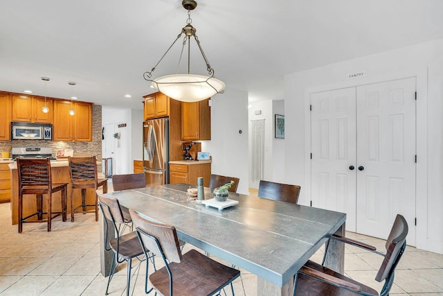 1138 Carlls Straight Path, Dix Hills, NY 11746 - dining area with light tile patterned flooring and recessed lighting