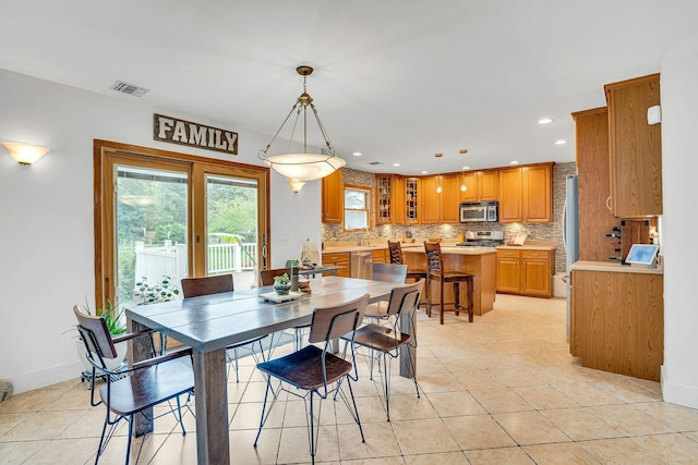 1138 Carlls Straight Path, Dix Hills, NY 11746 - dining area with light tile patterned flooring, recessed lighting, and baseboards