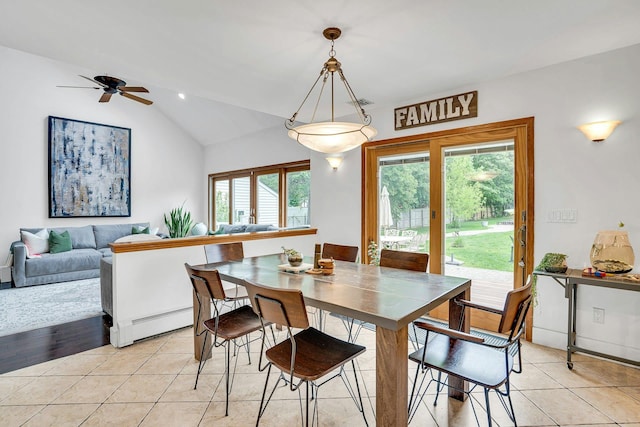 1138 Carlls Straight Path, Dix Hills, NY 11746 - dining room featuring baseboard heating, lofted ceiling, light tile patterned floors, and a ceiling fan