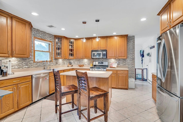 1138 Carlls Straight Path, Dix Hills, NY 11746 - kitchen featuring appliances with stainless steel finishes, tasteful backsplash, light countertops, brown cabinetry, and recessed lighting