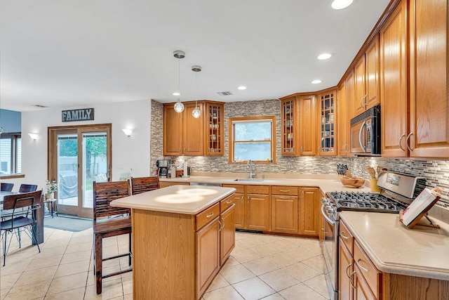 1138 Carlls Straight Path, Dix Hills, NY 11746 - kitchen with gas stove, a sink, tasteful backsplash, healthy amount of natural light, and recessed lighting